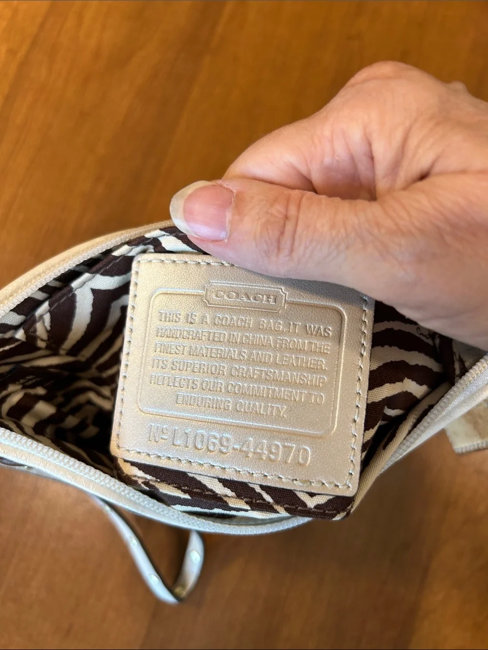 Coach Straw Wristlet with White Trim and Brown Floral Appliqués 2010